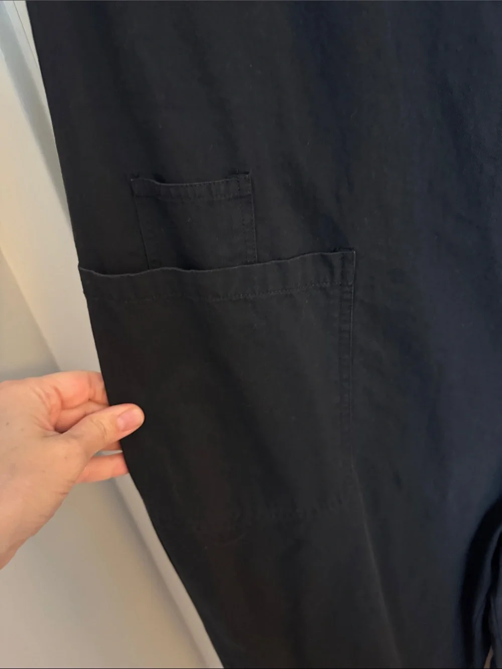 Sleeveless Black Jumpsuit with Front Buttons and utility pockets - Picture 5 of 12